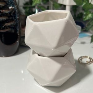 2 white plant holders